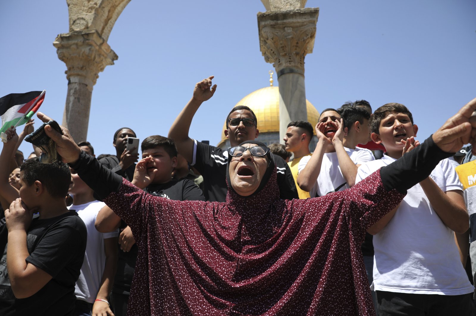 Palestinians chant slogans at a protest following Friday prayers at the Dome of the Rock Mosque at the Al-Aqsa Mosque compound in the Old City of Jerusalem, Friday, May 28, 2021. (AP Photo)