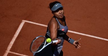 Japan's Naomi Osaka returns the ball to Romania's Patricia Maria Tig during their women's singles first round tennis match on Day 1 of the French Open, Paris, France, May 30, 2021. (AFP Photo)