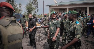 Military governor Lieutenant-General Ndima visits residents displaced by the volcanic eruption of Mount Nyiragongo to distribute government aid in Sake, near Goma, Democratic Republic of Congo, May 29, 2021. (AFP Photo)
