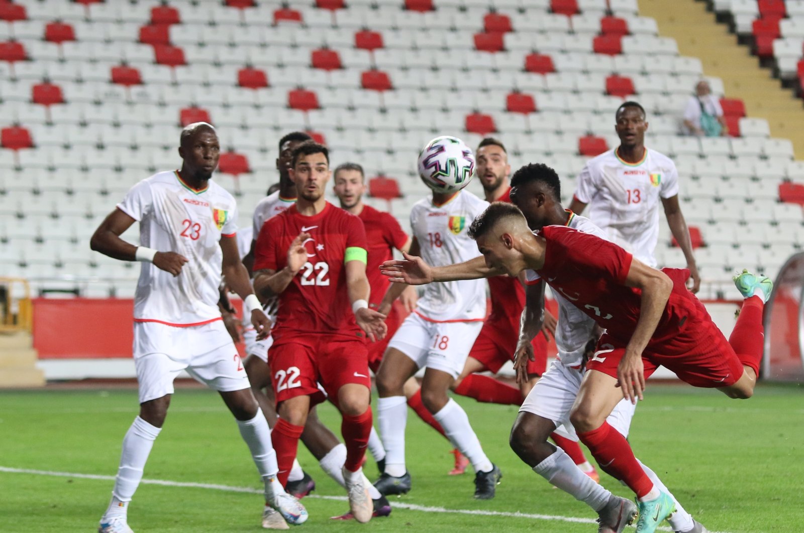 Turkey and Guinea players grapple for the ball during a friendly match at Antalya Stadium in Antalya, Turkey, May 31, 2021. (IHA Photo)