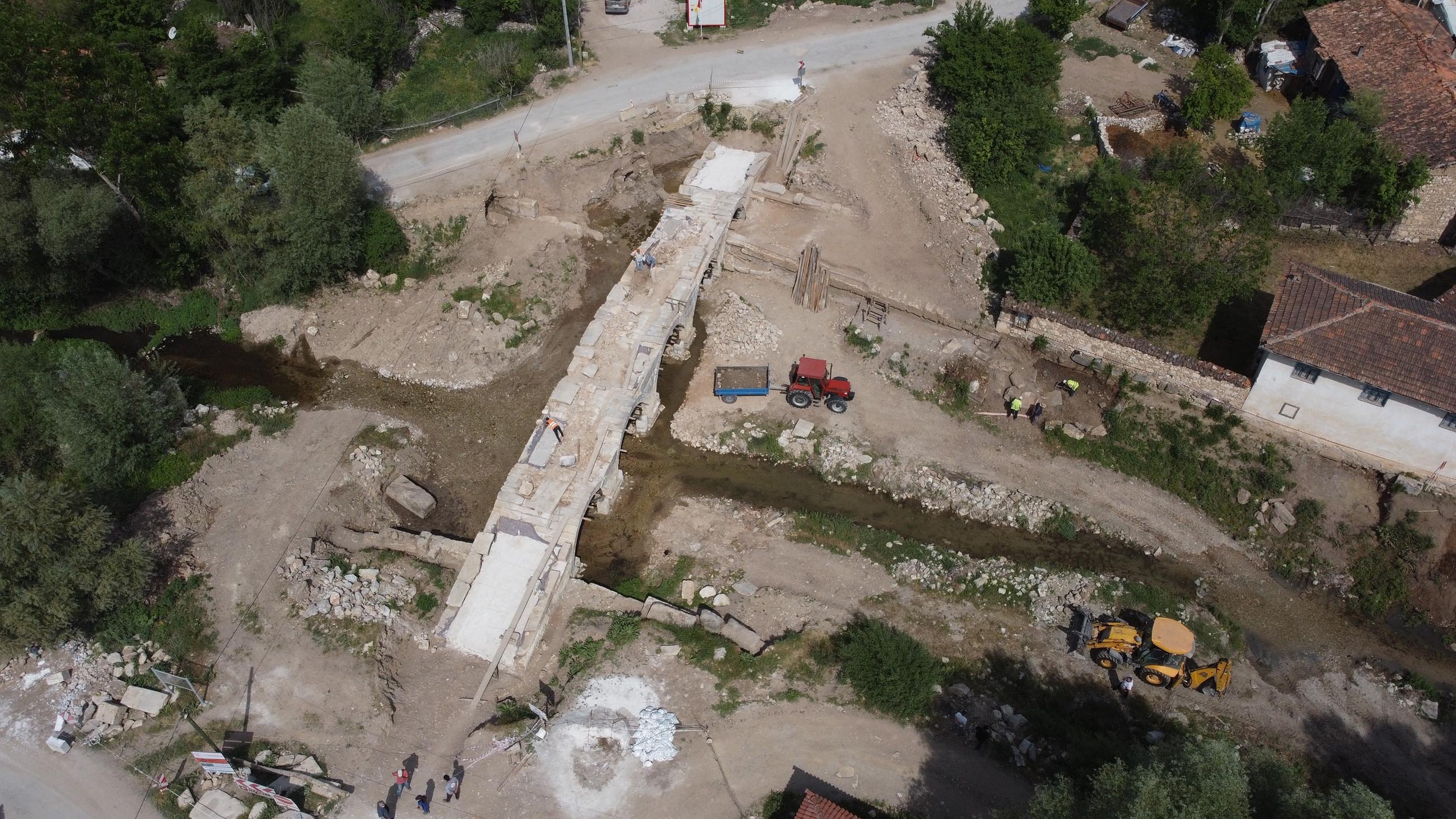 Specialists work on a historical Roman bridge that spans Kocaçay creek near the ancient city of Aizanoi in Kütahya, Turkey, May 30, 2021. (DHA Photo)