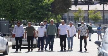 Atilla Peker (5th L) leaves the courthouse, in Muğla, southwestern Turkey, May 25, 2021. (AA PHOTO)