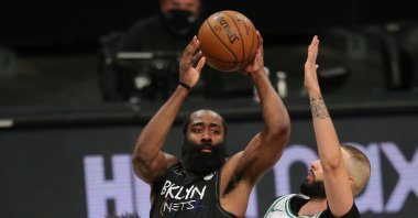 Brooklyn Nets shooting guard James Harden (C) looks to pass against Boston Celtics point guard Marcus Smart (L) and shooting guard Evan Fournier (R) during their 2021 NBA Playoffs at Barclays Center, Jun 1, 2021, Brooklyn, New York, U.S. (Reuters Photo)