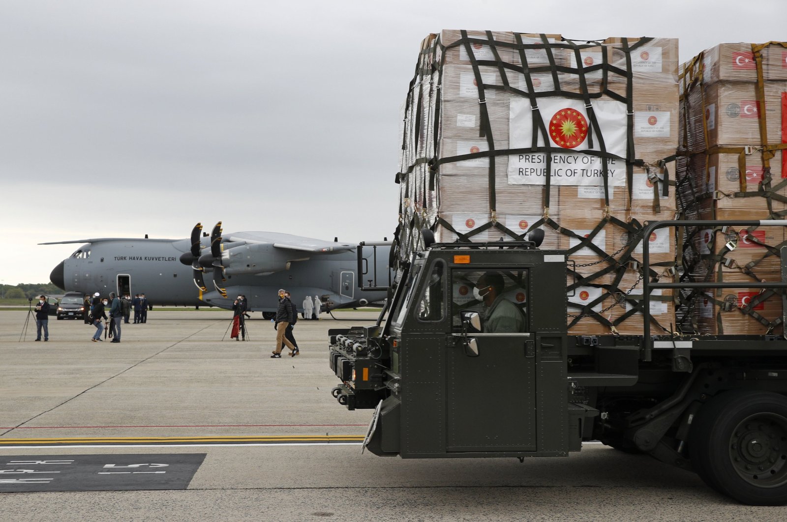 A U.S. Air Force vehicle carries a donation of medical supplies from Turkey after it was unloaded from a military plane, April 28, 2020. (AP Photo)