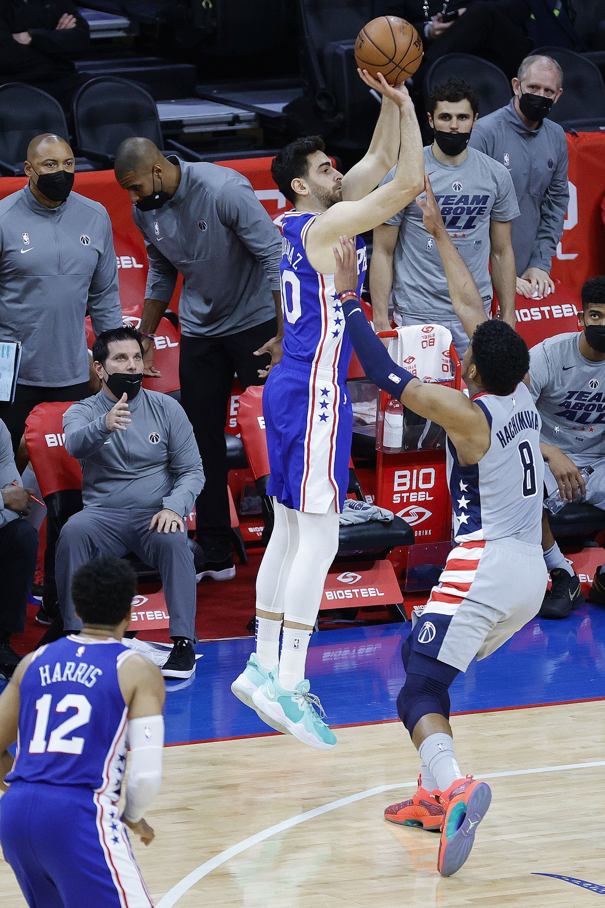 Philadelphia 76ers' Furkan Korkmaz (C) shoots over Washington Wizards Rui Hachimura (R) during their game five of the Eastern Conference first-round NBA Playoffs at Wells Fargo Center, Philadelphia, Pennsylvania, June 2, 2021.