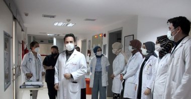 Doctors and other health care staff line the hallway at the hospital where the patient is being treated, in Trabzon, northern Turkey, June 3, 2021. (İHA PHOTO)