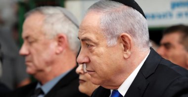 Israeli Prime Minister Benjamin Netanyahu looks on as he sits next to Benny Gantz, leader of Blue and White party, during a memorial ceremony for late Israeli President Shimon Peres, at Mount Herzl in Jerusalem, Israel, Sep. 19, 2019. (Reuters Photo)