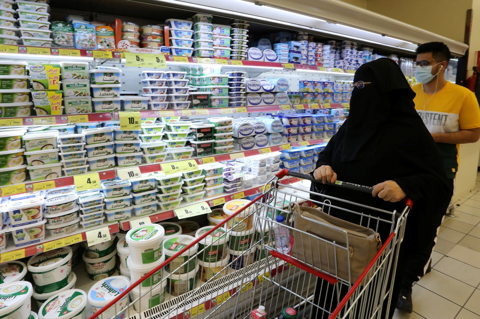 A Saudi woman looks at dairy products in a supermarket in Riyadh, Saudi Arabia, Oct. 18, 2020. (Reuters Photo)