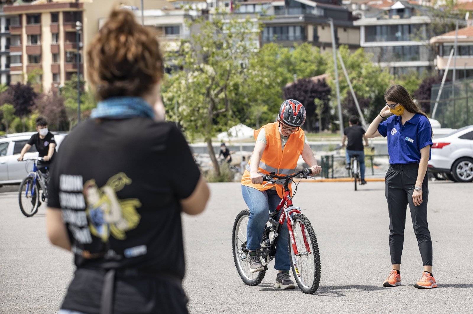 The group's members teach a woman how to ride, in Istanbul, Turkey, June 3, 2021. (AA PHOTO)