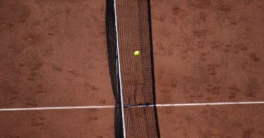 The ball passes over the net during a French Open tennis match at the Roland Garros stadium, Paris, France, May 30, 2021.(AP Photo)