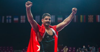 Turkish wrestler Taha Akgül celebrates winning the 125-kg gold medal match against Russia's Sergei Kozyrev at the 2021 European Wrestling Championships, in Warsaw, Poland, May 21, 2021. (AA Photo)