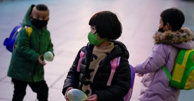 Children wearing face masks are seen at Shanghai railway station, Shanghai, China March 5, 2020. (Reuters Photo)