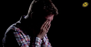 Belarusian journalist Roman Protasevich, detained last month after his flight was forced to land in Minsk, reacts during an interview with Belarusian state television, in this still image taken from undated video footage. (ONT TV Channel via Reuters TV)