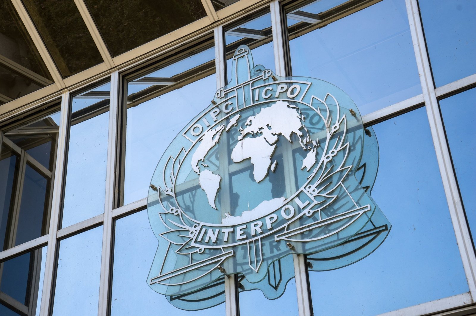 A sign on the facade of the Interpol headquarters. Interpol is an intergovernmental organization facilitating international police cooperation, Lyon, France, Sept. 21, 2015. (Shutterstock Photo)