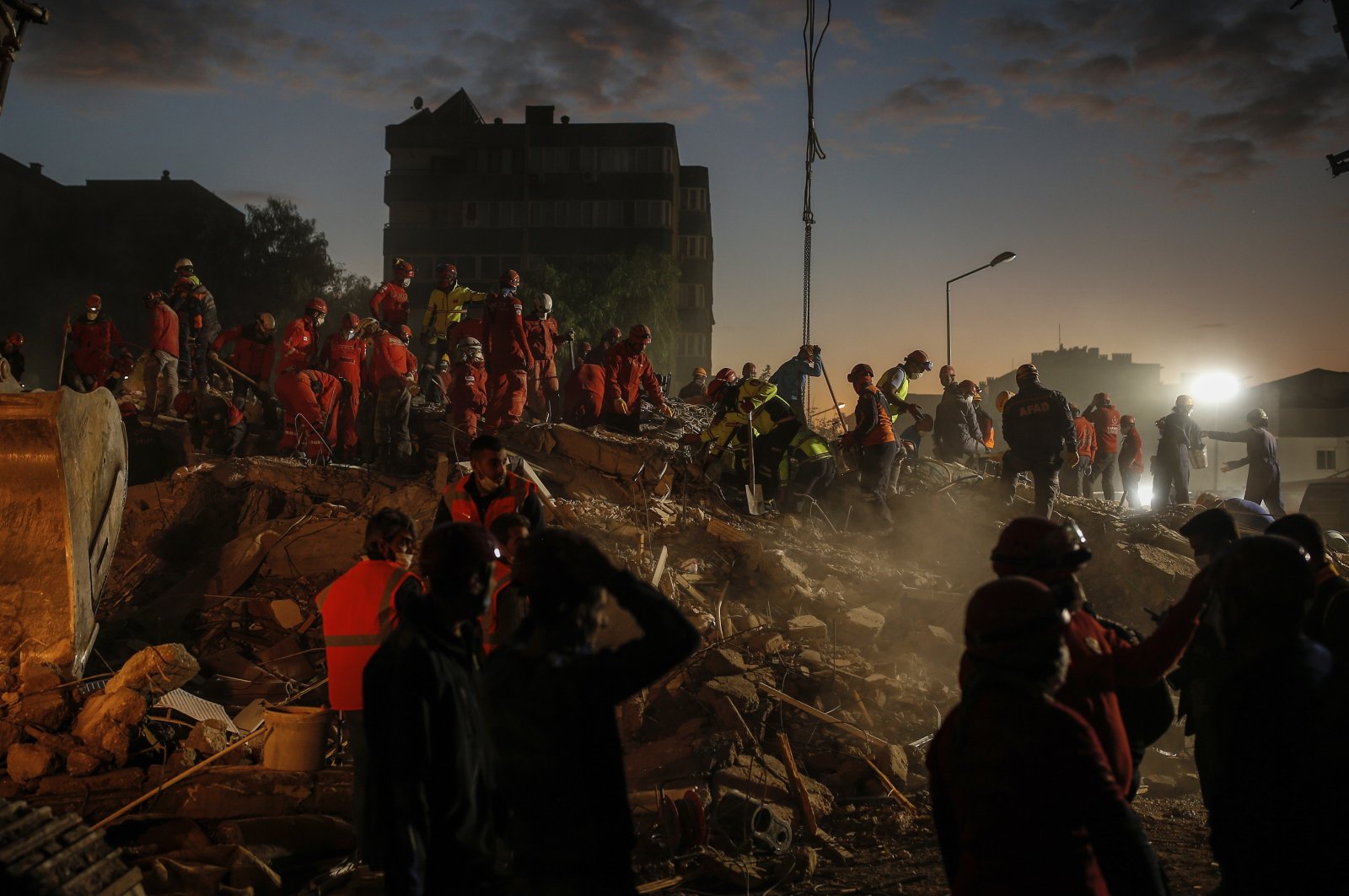 Members of rescue services search for survivors in the debris of a collapsed building in Izmir, Turkey, Nov. 2, 2020. (AP Photo)