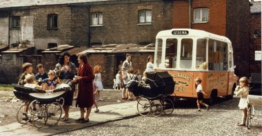 Shirley Baker, "Ice cream van on a terraced street, Manchester," 1965, color photograph, 34 by 51 centimeters. (Courtesy of the British Council)