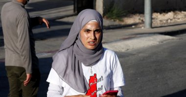 In this file photo taken on May 29, 2021, Palestinian activist Muna el-Kurd takes part in a rally to demand the reopening of the Israeli police checkpoint at the entrance of the Sheikh Jarrah neighborhood in occupied East Jerusalem, Palestine. (AFP Photo)