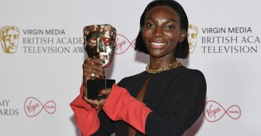 Michaela Coel poses with her leading actress award for her role in “I May Destroy You,” backstage at the British Academy Television Awards in London, U.K., June 6, 2021. (AP Photo)