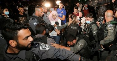 Prominent Palestinian activist Muna al-Kurd reacts during scuffles with Israeli police amid ongoing tension ahead of an upcoming court hearing in an Israeli-Palestinian land-ownership dispute in the Sheikh Jarrah neighborhood of East Jerusalem, occupied Palestine, May 4, 2021. (Reuters Photo)