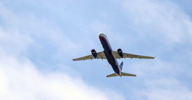 A Russian Air Force Tu-214 flies over Offutt Air Force Base, in Omaha, Nebraska, U.S., April 26, 2019. (AP Photo)