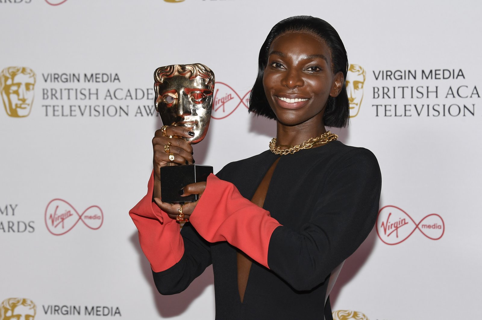 Michaela Coel poses with her leading actress award for her role in “I May Destroy You,” backstage at the British Academy Television Awards in London, U.K., June 6, 2021. (AP Photo)