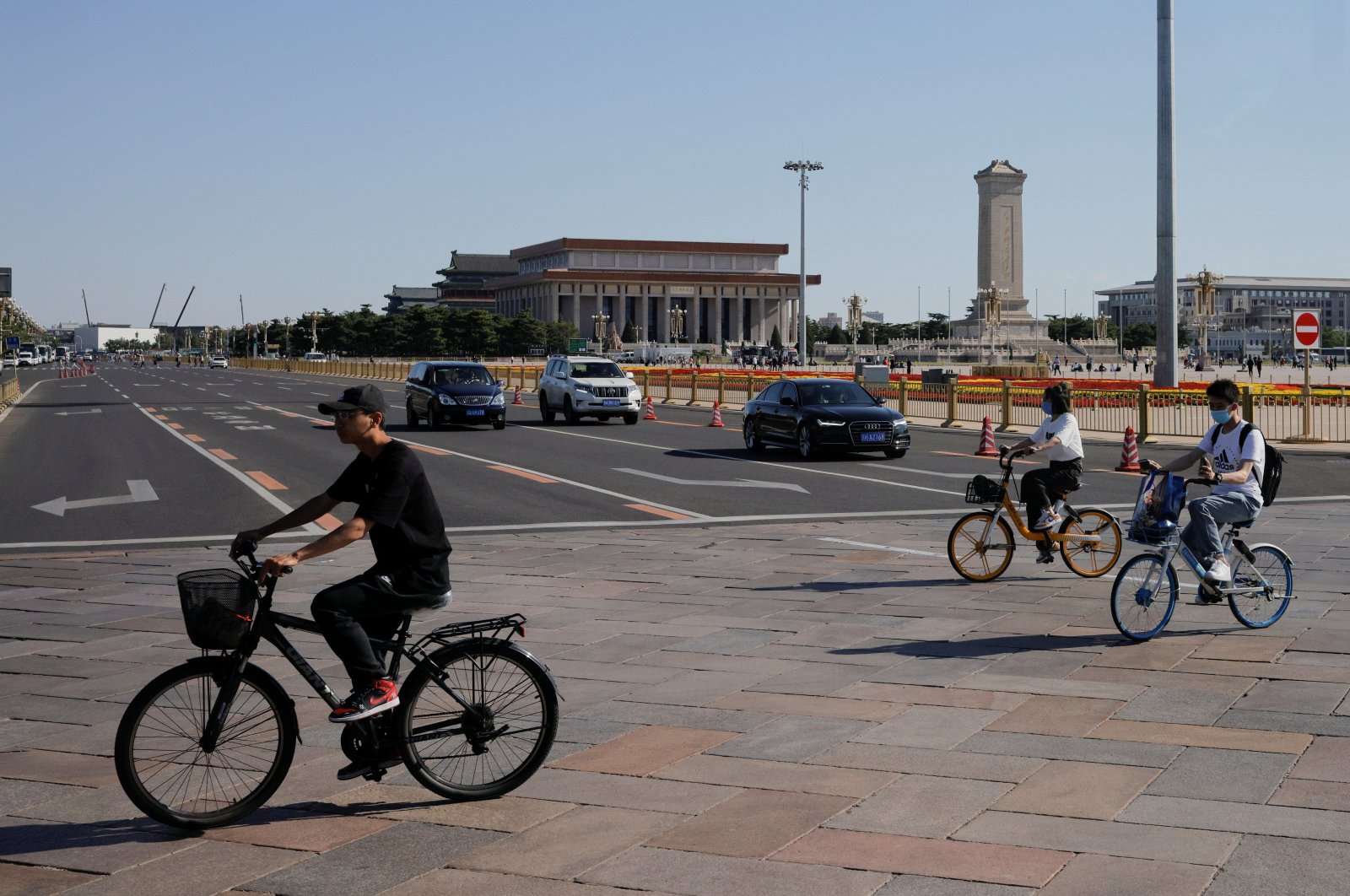Cyclists cross Tiananmen Square in Beijing, China, June 3, 2021. (Reuters Photo)