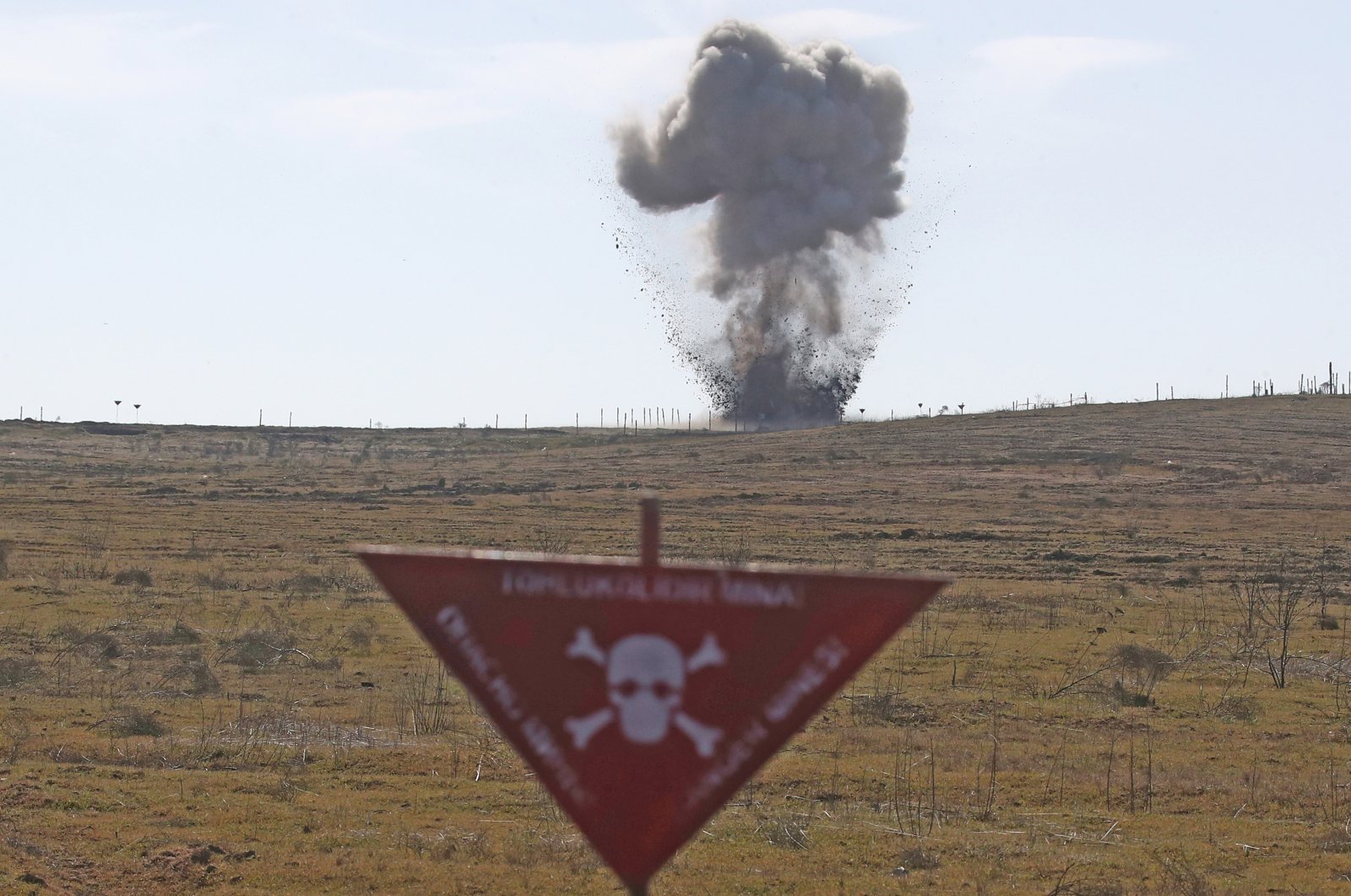 Unexploded ammunition is detonated during a demo mine clearing operation by the Azerbaijan National Agency for Mine Action (ANAMA) to further operations to clear mines previously planted by Armenian forces, Fuzuli, Azerbaijan, Feb. 27, 2021. (Photo by Getty Imags)