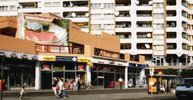 Sun shines on residential buildings and a housing complex known as the "Neue Kreuzberger Zentrum (NKZ)" at Kottbusser Tor, Berlin, Germany. (Getty Images)