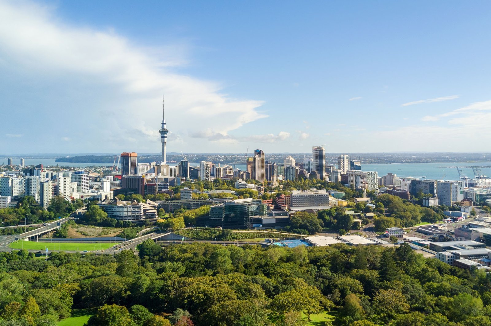 Blue sky breaks through the clouds over Auckland, New Zealand. (Shutterstock Photo)