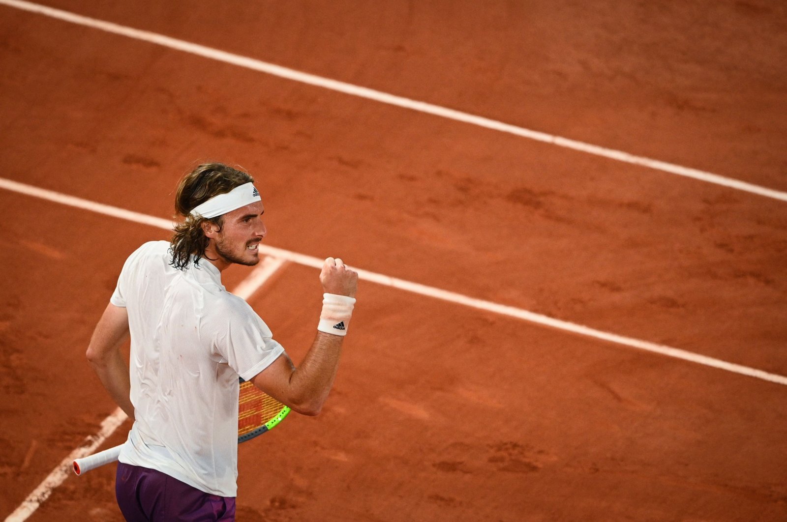 Greece's Stefanos Tsitsipas celebrates winning a point against Russia's Daniil Medvedev during their French Open quarterfinal match at the Roland Garros, Paris, France, June 8, 2021. (AFP Photo)