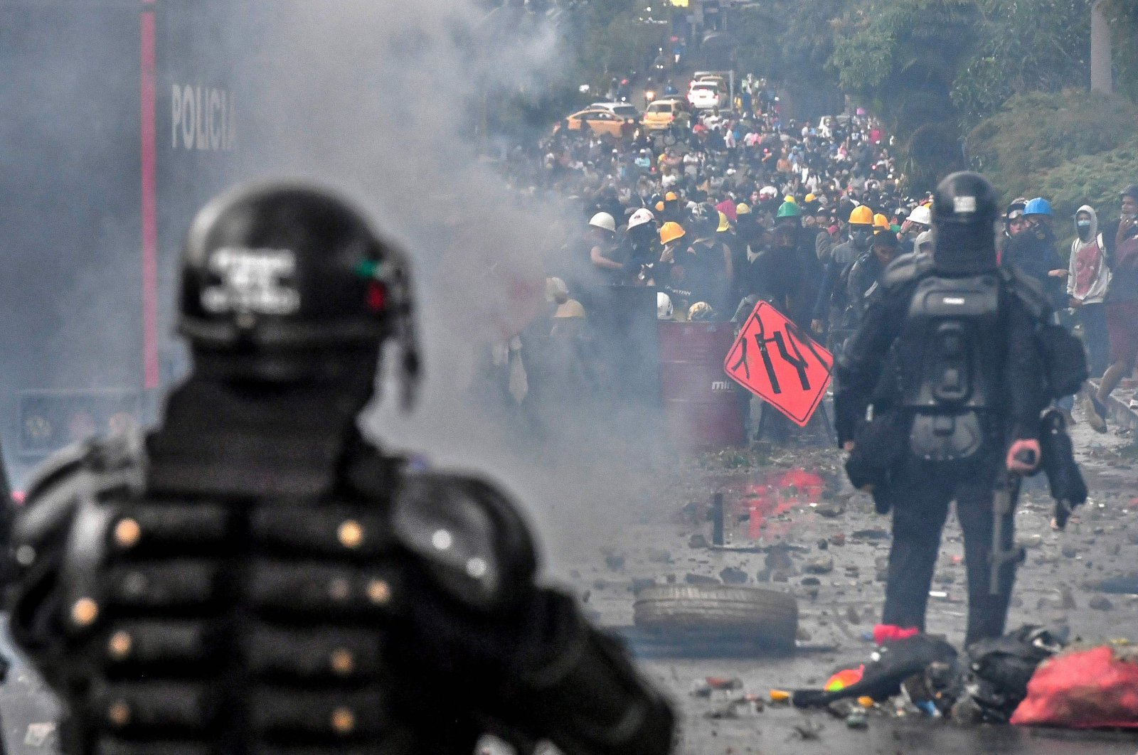 Riot police clash with demonstrators in a new protest against the government of Colombian President Ivan Duque in Medellin, Colombia, on June 2, 2021. (AFP Photo)