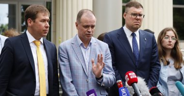 Russian lawyer Ivan Pavlov (C), gestures while speaking to the media as other lawyers stand around him during a break in a court session in front of Moscow Court, in Moscow, Russia, June 9, 2021. (AP Photo)