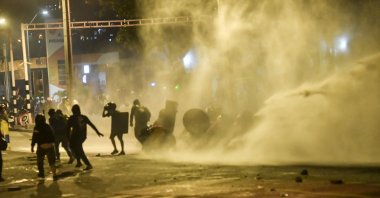 Demonstrators clash with riot police during a protest against the government of Colombian President Ivan Duque in Medellin, Colombia on June 9, 2021. (AFP Photo)