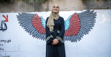 Muna al-Kurd, a 23-year-old Palestinian activist, poses for a photo in Sheikh Jarrah, occupied East Jerusalem, Palestine, June 10, 2021. (AA Photo)