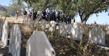 People attend a commemoration ceremony at the graves of 27 people who were killed by PKK terrorists in 1990, Şırnak, Turkey, June 10, 2021. (AA Photo)