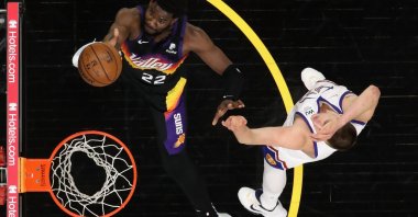 Phoenix Suns' Deandre Ayton (L) lays up a shot past Denver Nuggets' Nikola Jokic during Game 2 of the Western Conference second-round playoffs at Phoenix Suns Arena, Phoenix, Arizona, U.S., June 09, 2021.