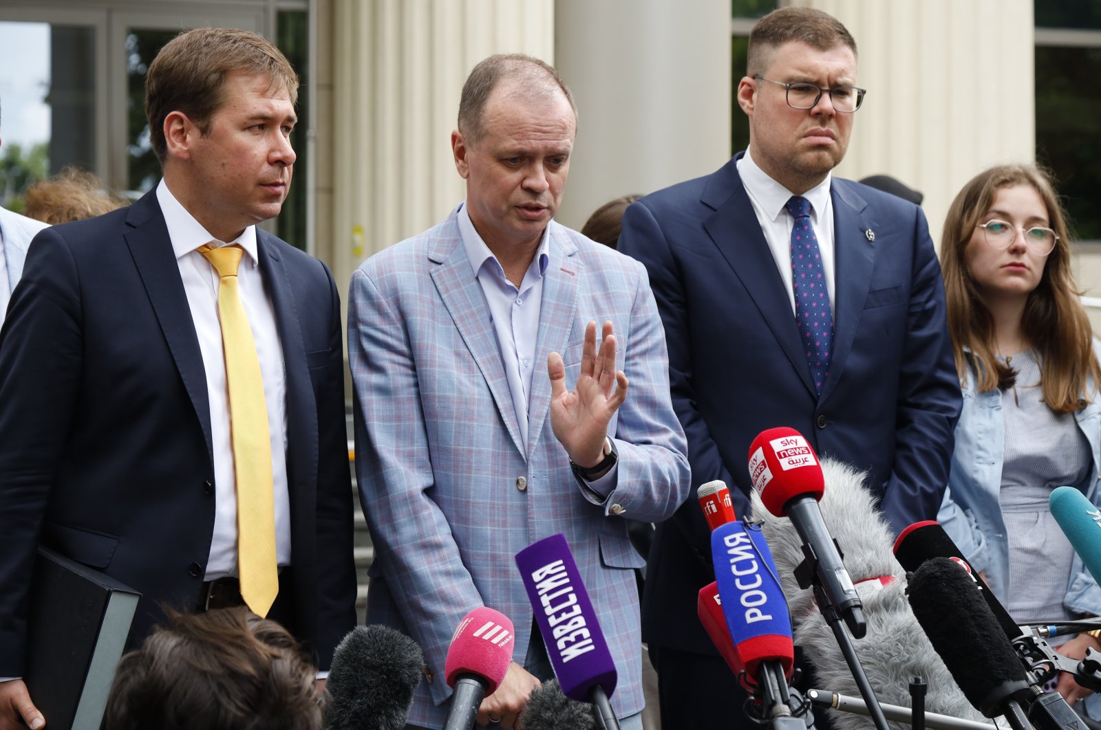 Russian lawyer Ivan Pavlov (C), gestures while speaking to the media as other lawyers stand around him during a break in a court session in front of Moscow Court, in Moscow, Russia, June 9, 2021. (AP Photo)