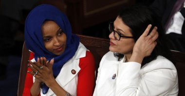 Congresswomen Ilhan Omar (L) and Rashida Tlaib listen as former U.S. President Donald Trump delivers his State of the Union address to a joint session of Congress on Capitol Hill in Washington D.C., U.S., Feb. 5, 2019. (AP Photo)