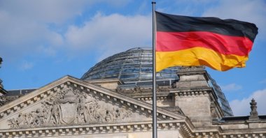 This file photo shows the German flag in front of the German parliament, also known as Bundestag, in the capital Berlin. (AA Photo)