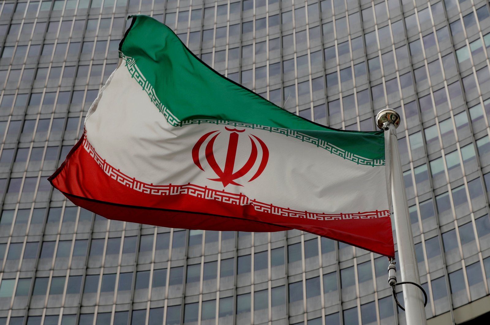 An Iranian flag flutters in front of the International Atomic Energy Agency (IAEA) headquarters in Vienna, Austria, Sept. 9, 2019. (Reuters Photo)