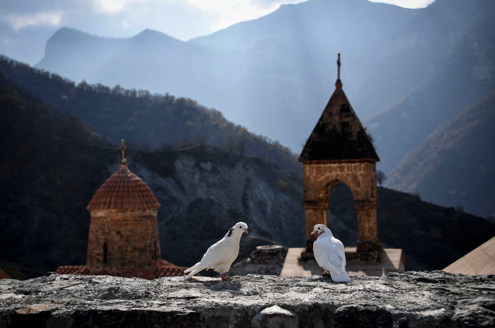 Two white doves stand on a wall of the 12th-13th century Orthodox Dadivank monastery, outside the town of Kalbajar, Azerbaijan, Nov. 12, 2020. (AFP Photo)