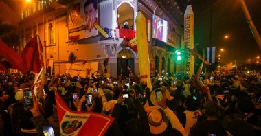 Peru's left-wing presidential candidate Pedro Castillo of the Peru Libre party gestures as he speaks to his supporters from the balcony of his party headquarters, Lima, Peru, June 10, 2021. (AFP Photo)