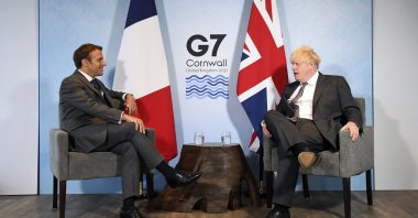 Britain's Prime Minister Boris Johnson (R) and French President Emmanuel Macron ahead of a bilateral meeting during the G-7 summit in Cornwall, England, June 12, 2021. (Pool via AP)