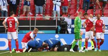 Medics attend to Denmark's midfielder Christian Eriksen after he collapsed during the UEFA EURO 2020 Group B football match between Denmark and Finland at Parken Stadium in Copenhagen, Denmark, June 12, 2021. (AFP Photo)