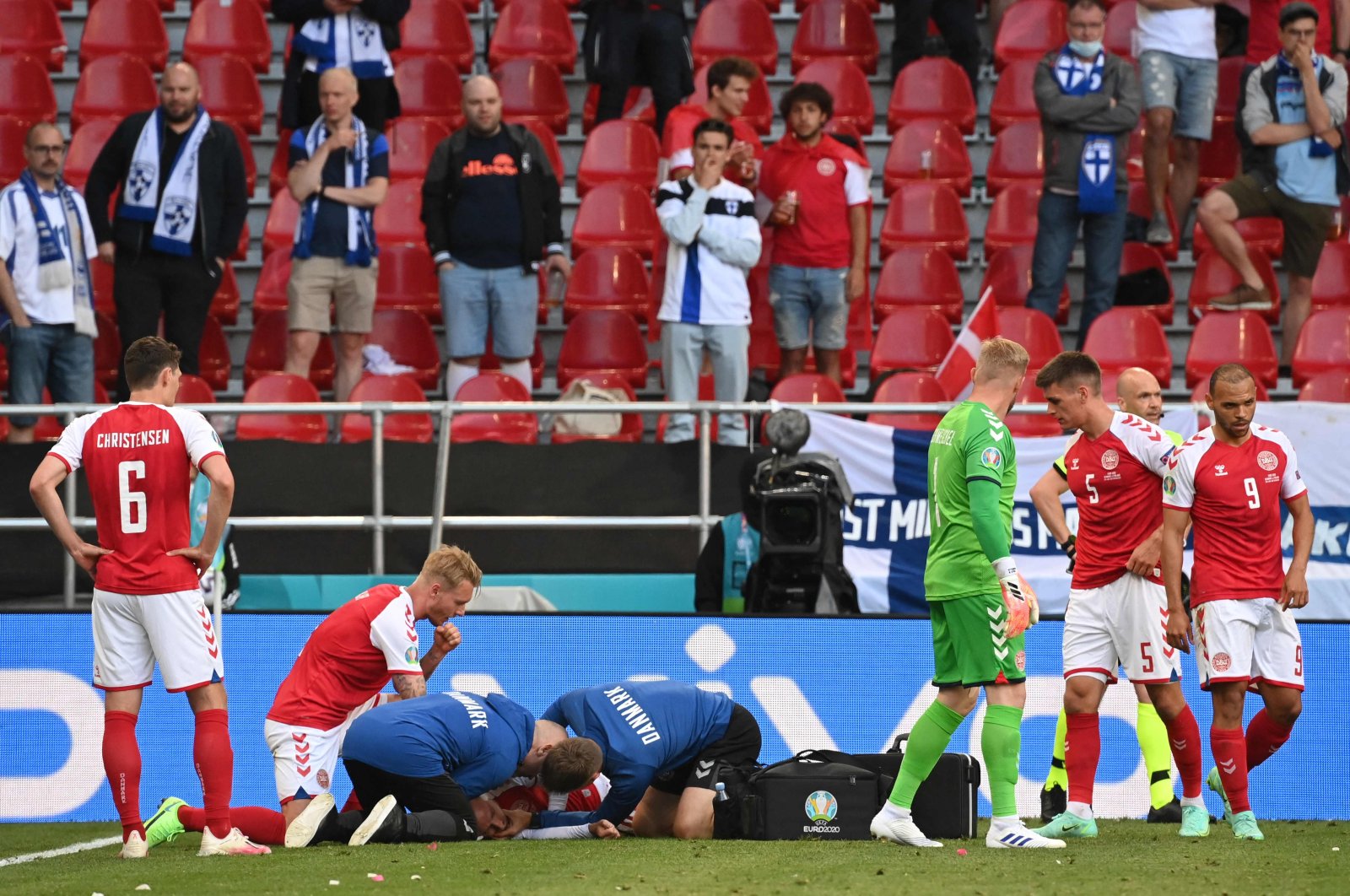 Medics attend to Denmark's midfielder Christian Eriksen after he collapsed during the UEFA EURO 2020 Group B football match between Denmark and Finland at Parken Stadium in Copenhagen, Denmark, June 12, 2021. (AFP Photo)