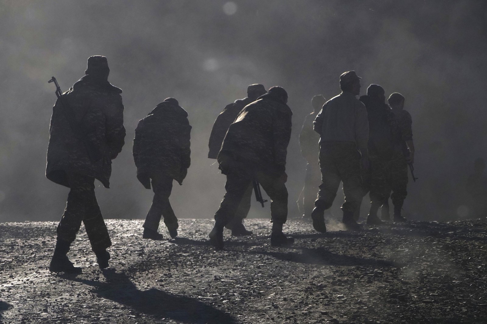 Armenian soldiers walk along the road near the border between Armenia and Nagorno-Karabakh, Azerbaijan, Nov. 8, 2020. (AP Photo)