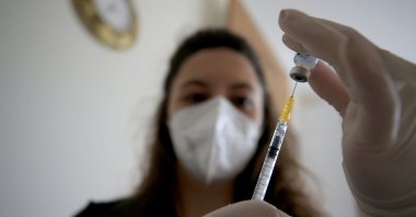 A nurse inserts a syringe into a COVID-19 vial at the Kırklareli Training and Research Hospital in Kırklareli, northwestern Turkey, June 6, 2021. (AA Photo)