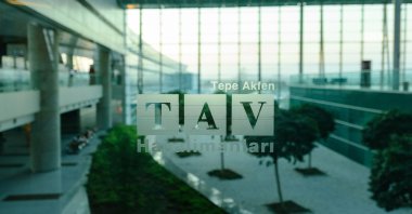 The TAV Airports Holding logo is printed on glass at the Esenboğa International Airport, Ankara, Turkey, Aug. 19, 2017. (Shutterstock Photo)