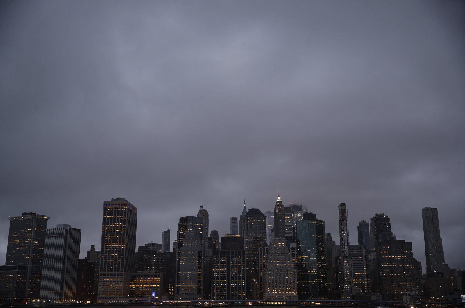 Rain clouds hang over the downtown Manhattan skyline, in New York City, New York, U.S., March 17, 2020. (AP Photo)