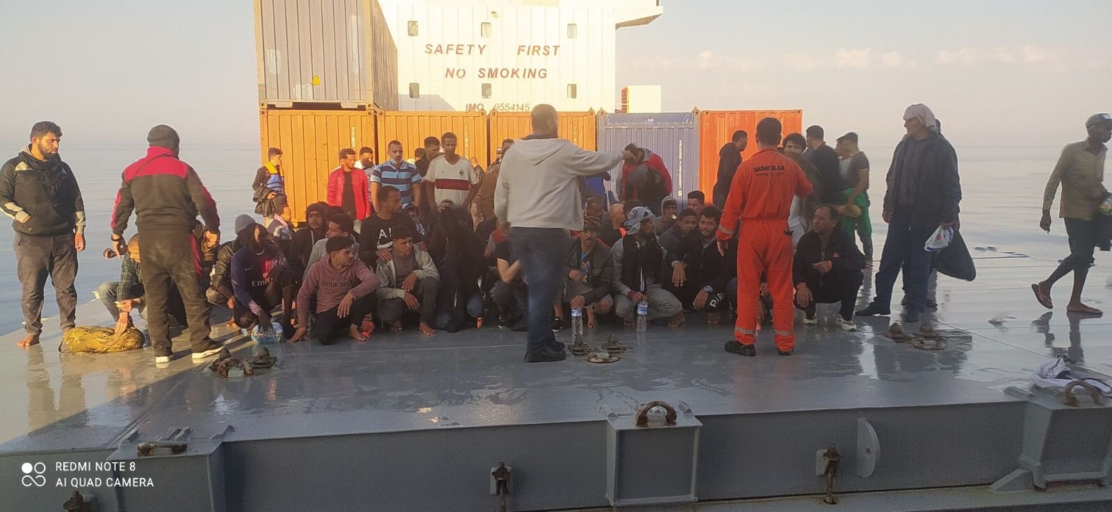 Migrants saved by the Turkish captain rest aboard the vessel, off the coast of Malta, June 12, 2021. (DHA PHOTO) 